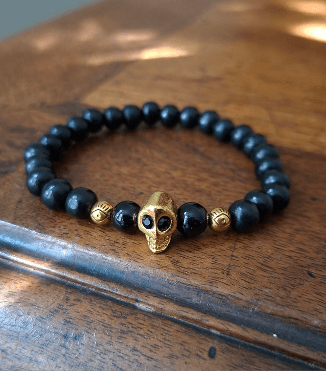 Bracelet noir crâne doré 